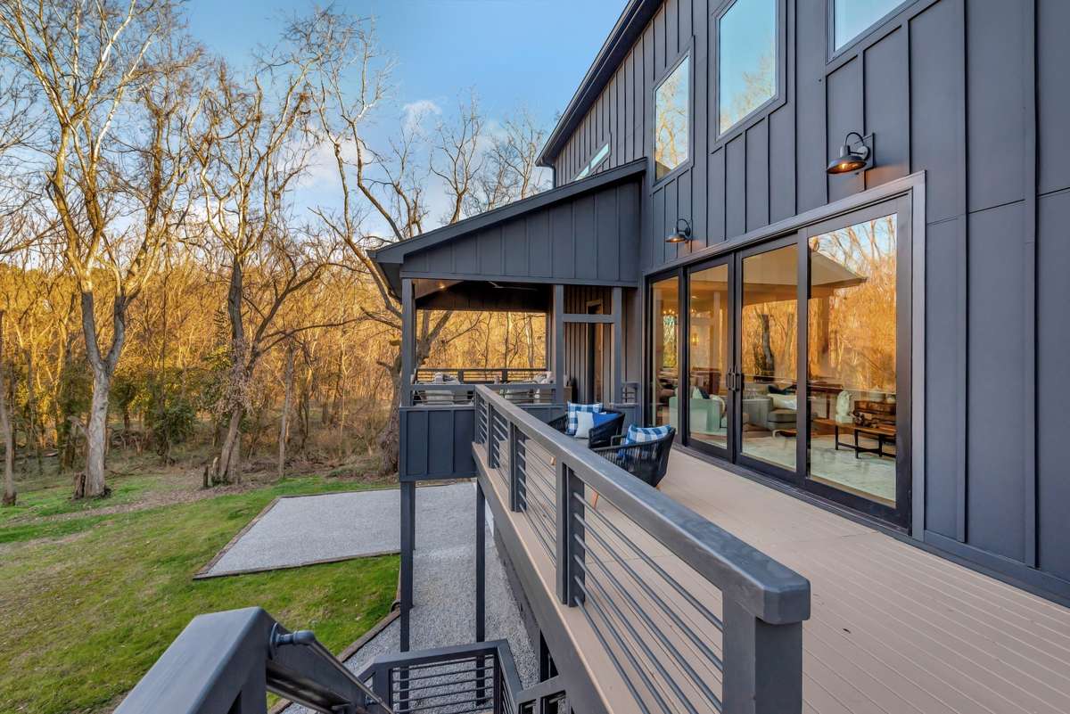 Staircase leads you down to a terrace and fire pit