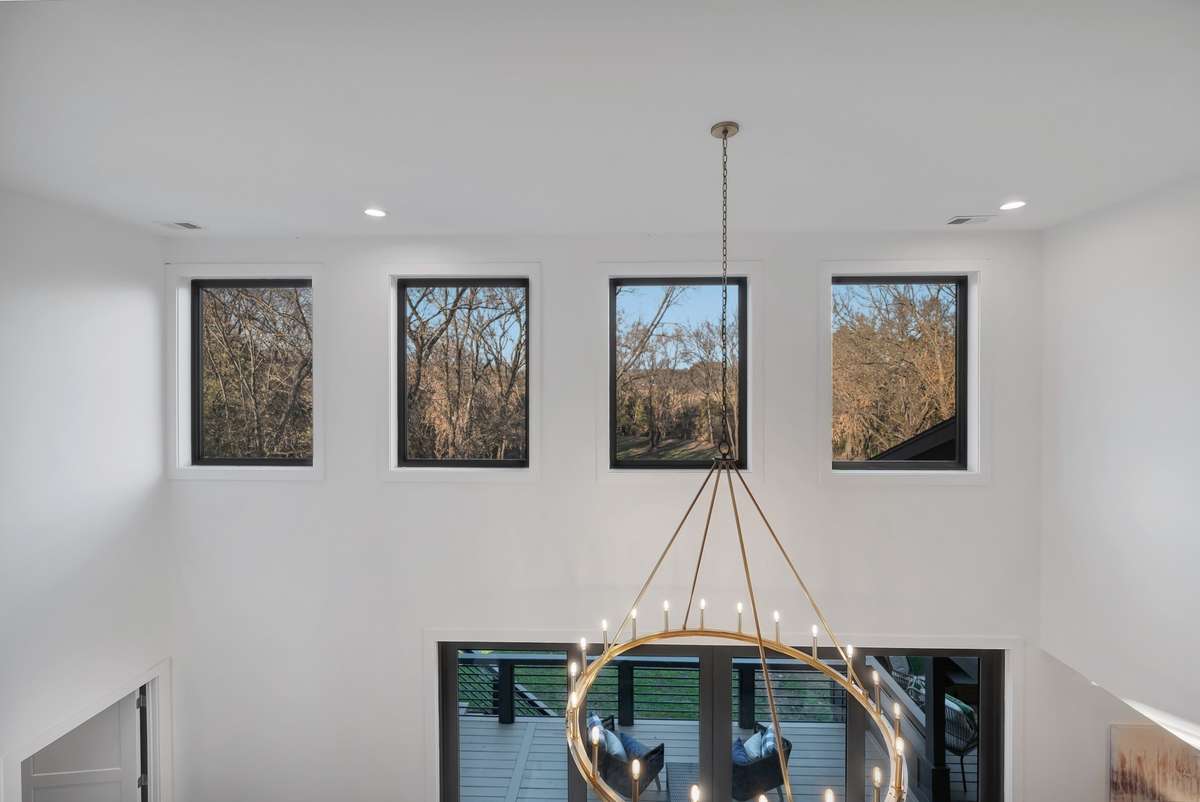 This wall of windows offers views and light streaming in