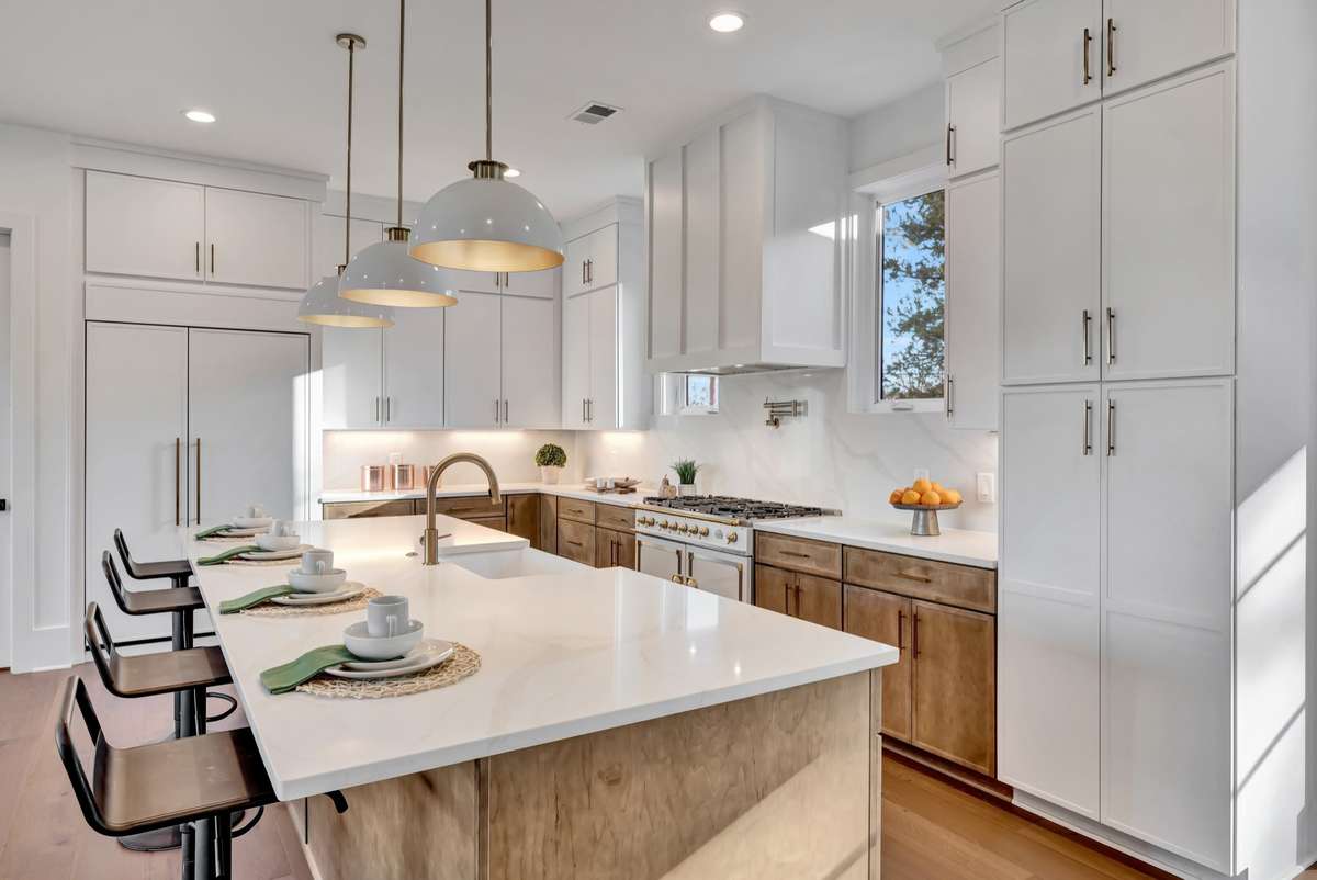 A true Cooks Kitchen w no detail overlooked
Gourmet French Gas Range w pot filler, Built-in Refrigerator, 2 Pantries, Beautiful Custom Floor to Ceiling Cabinetry, Expansive Island.  All open and overlooking the Backyard & River