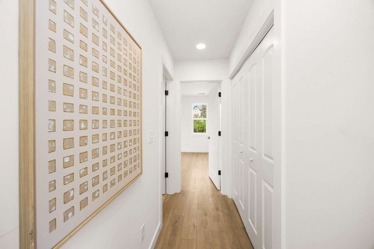 A view of the hallway from the Living/Open Space into the Primary Bedroom Area