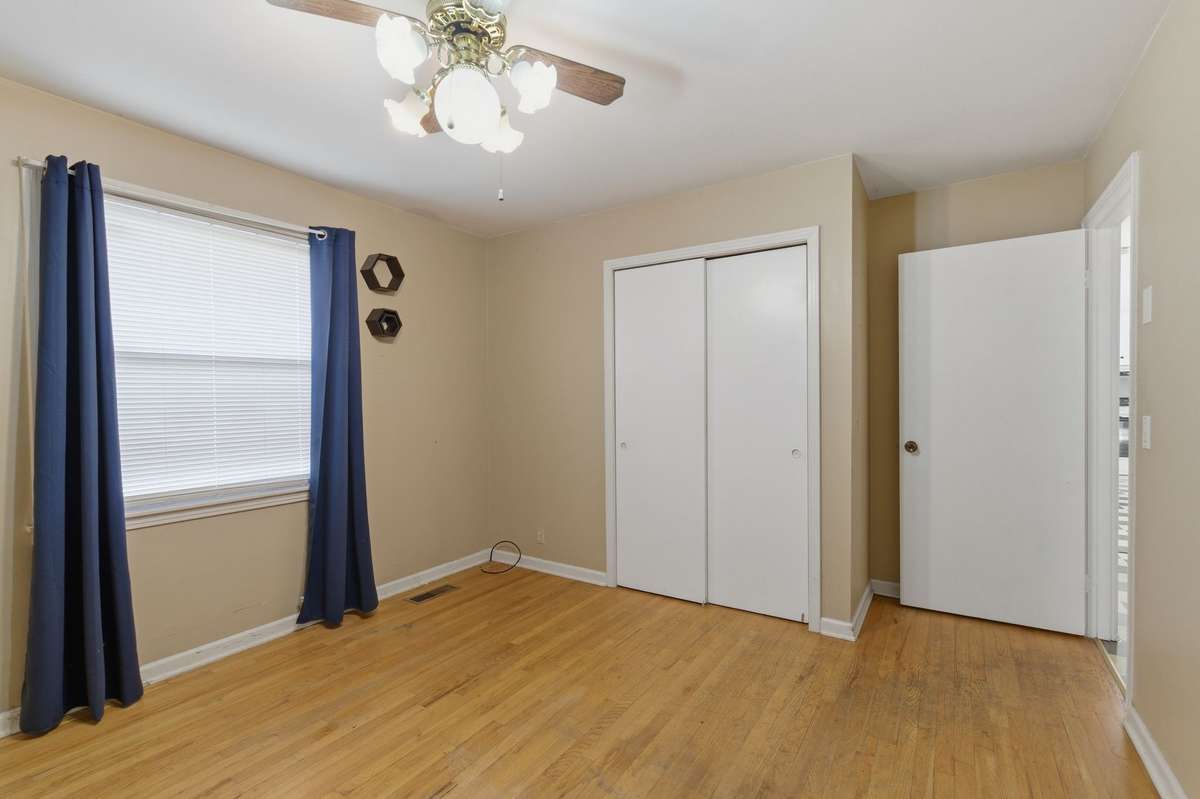 Another view of the Main Bedroom that features an EX-LARGE CLOSET and CEILING FAN.