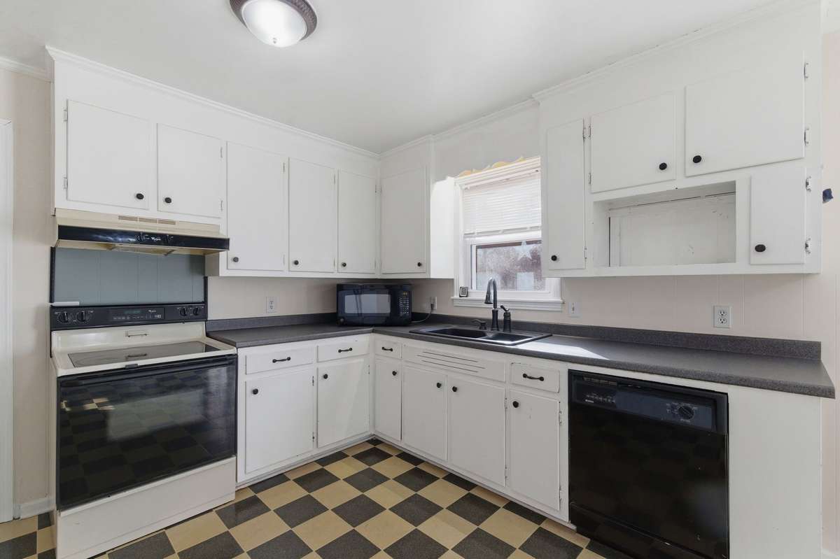 The Kitchen features LOTS OF CABINETS and COUNTERTOP SPACE.