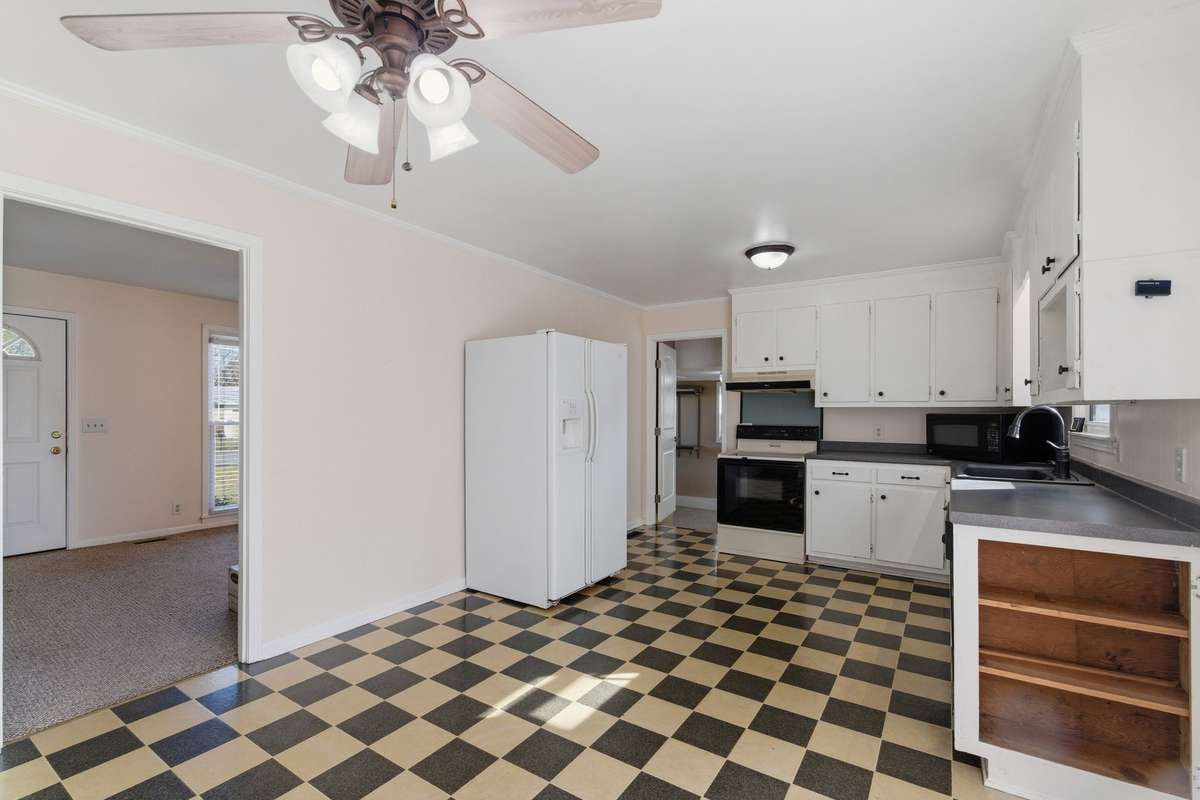 Another view of the Kitchen and Dining Area.  ALL APPLIANCES REMAIN, including the WASHER & DRYER set.
