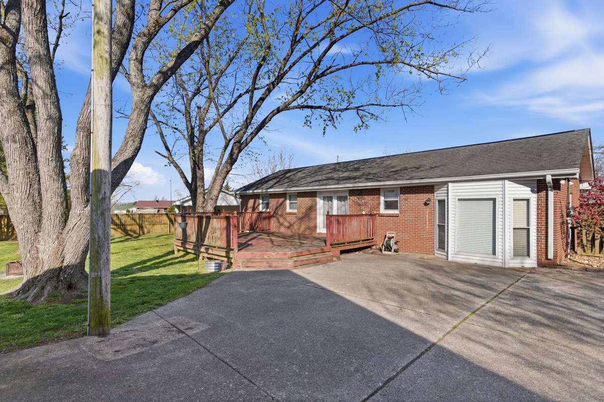 A rear photo of the Home.  There's lots of Parking Space.