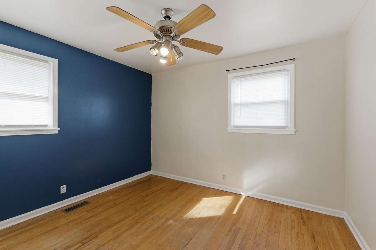 Bedroom #2 features TWO WINDOWS and a CEILING FAN.