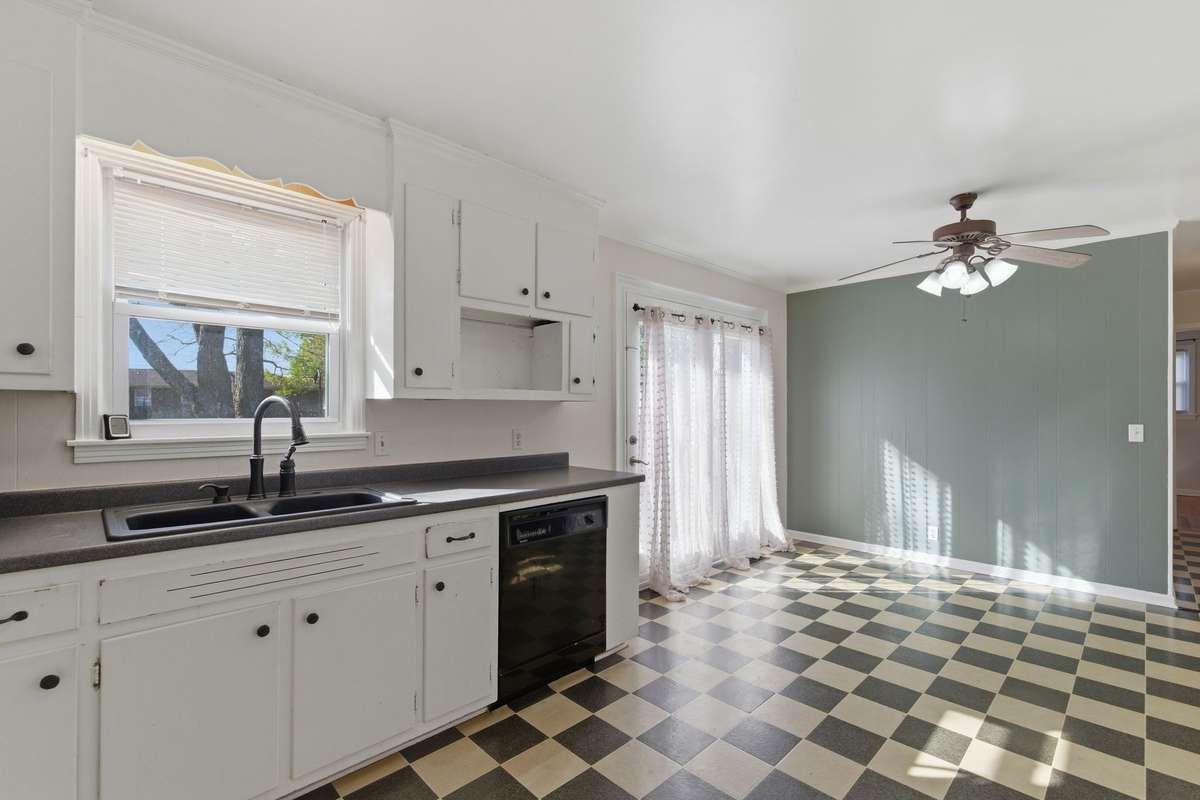 The Kitchen and Dining Area features French Doors that open onto the Rear Deck.