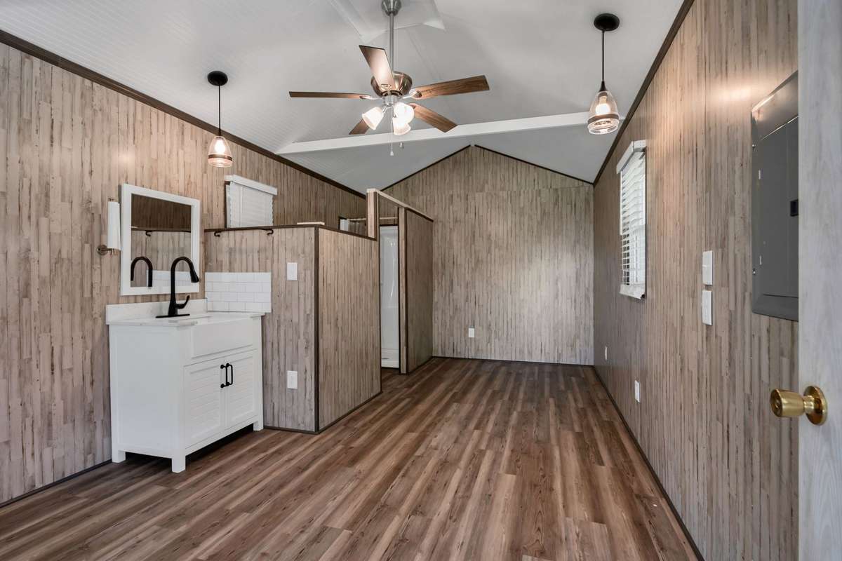 There's also a bathroom area with a shower, sink & toilet as well as upgraded windows from Window World.