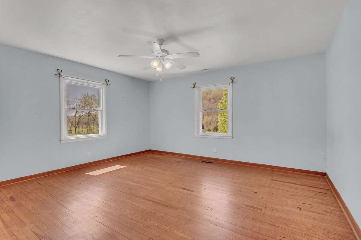 The master bedroom is a good size and has natural lighting facing both the front and side of the home.