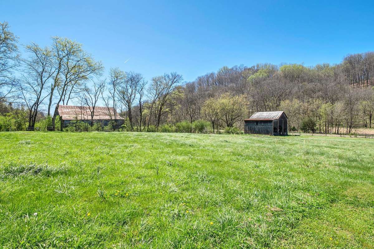 In the front pasture is the tobacco barn.  It has been reinforced and is in good condition.