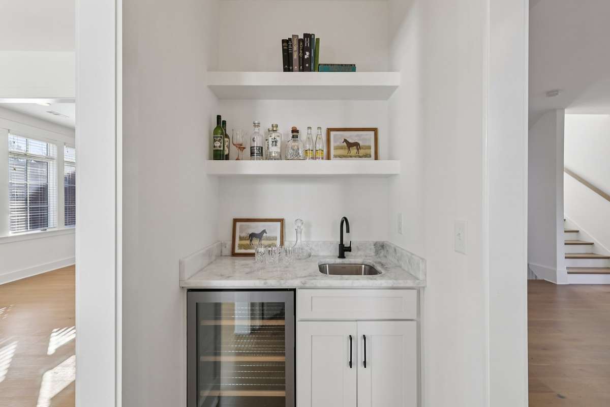 Wet bar with sink and wine fridge