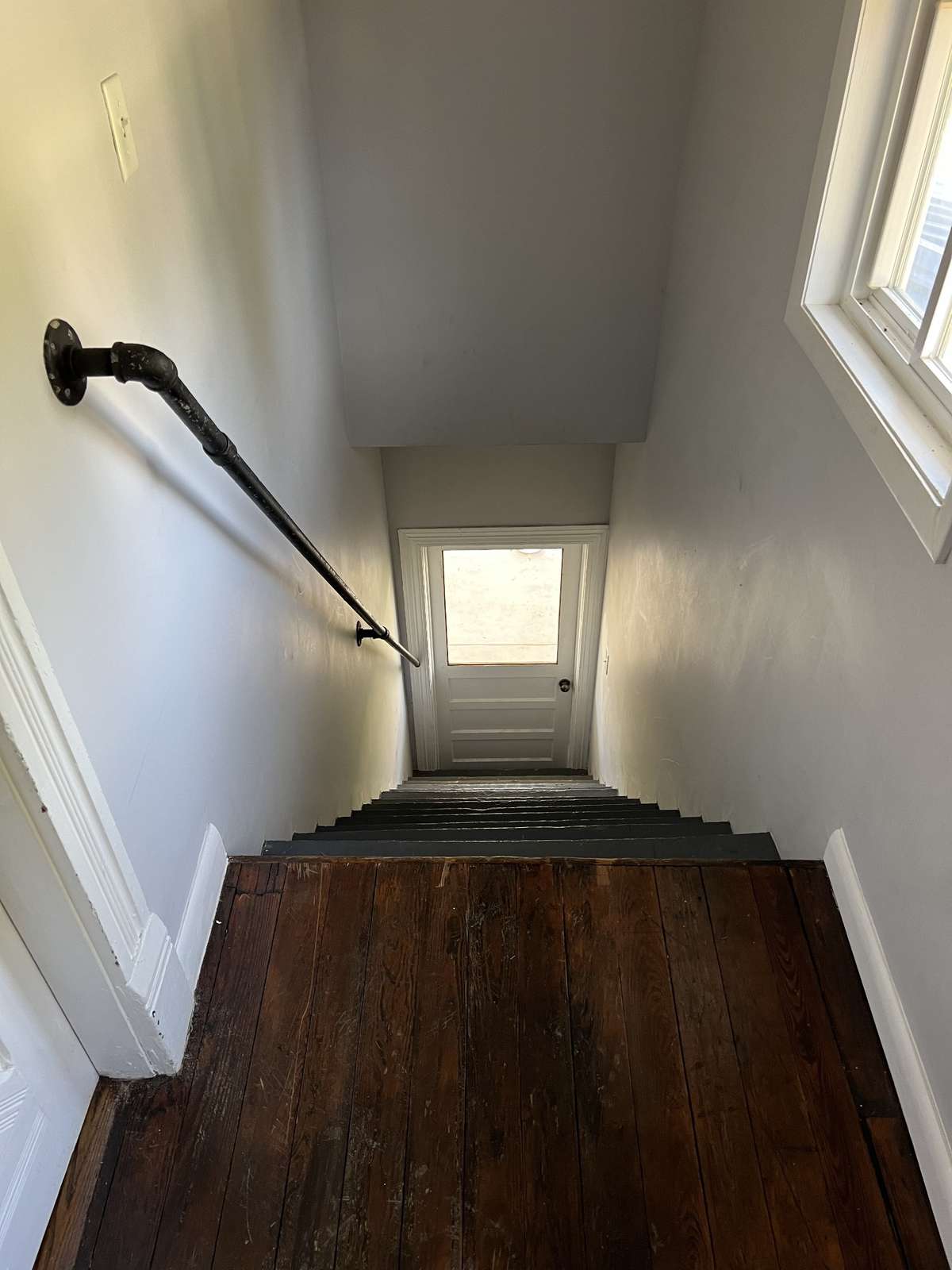 Stairway for private second floor entrance from front porch