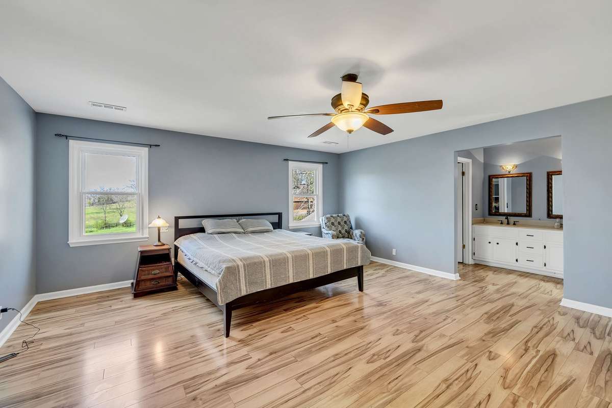 Full bath with double vanities and a large walk in closet.