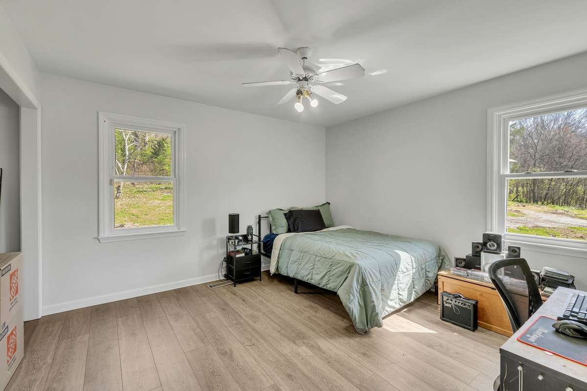 Bedroom # 1 on the main level.  This floorplan is so flexible.  It could has two extra rooms that could be a bedroom if you prefer or need an office on the main level.