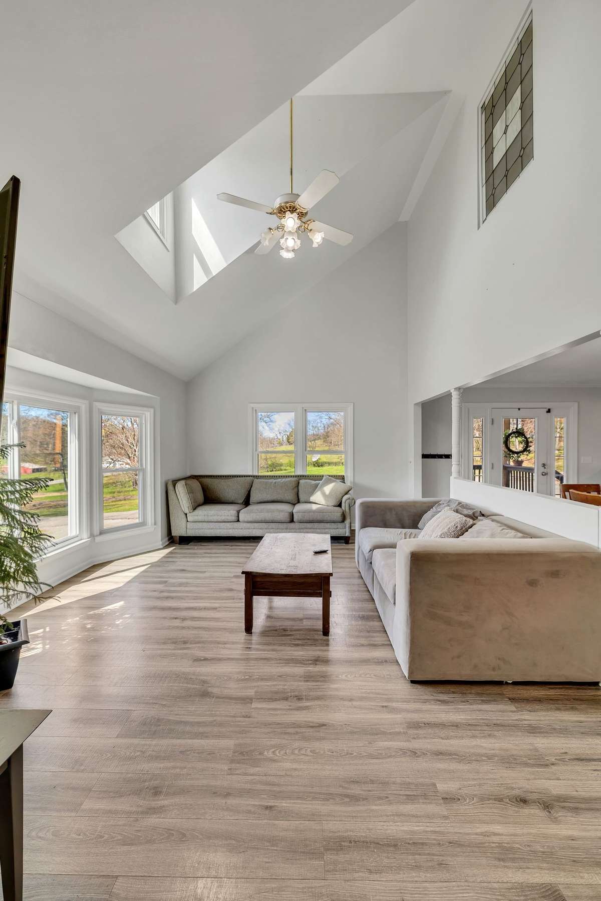 Light filled family room with a gorgeous ceiling, skylight and open to the kitchen/dining area.