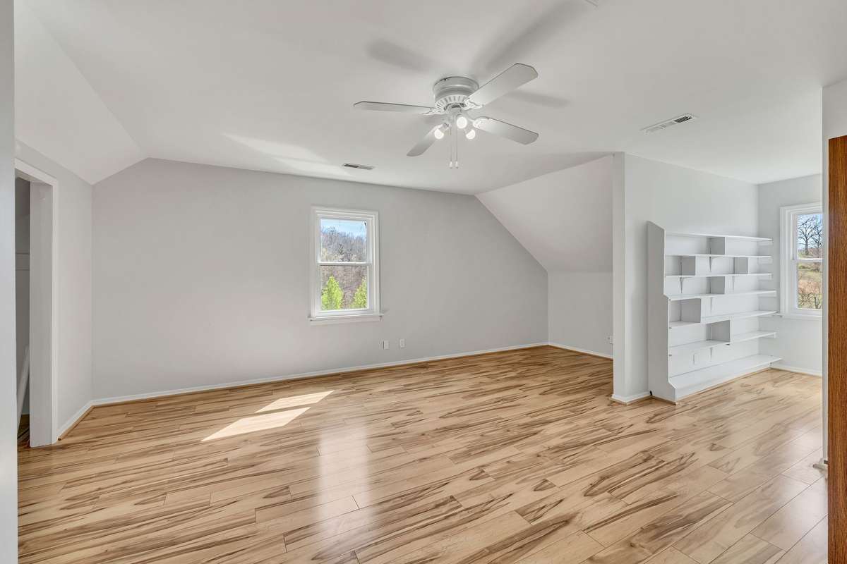 The second room upstairs could be a dormitory style bedroom it is so large, a playroom, rec room, home theatre etc.  This room has a bath so could be a future bdrm however SEPTIC IS APPROVED FOR A 3 BD HM.