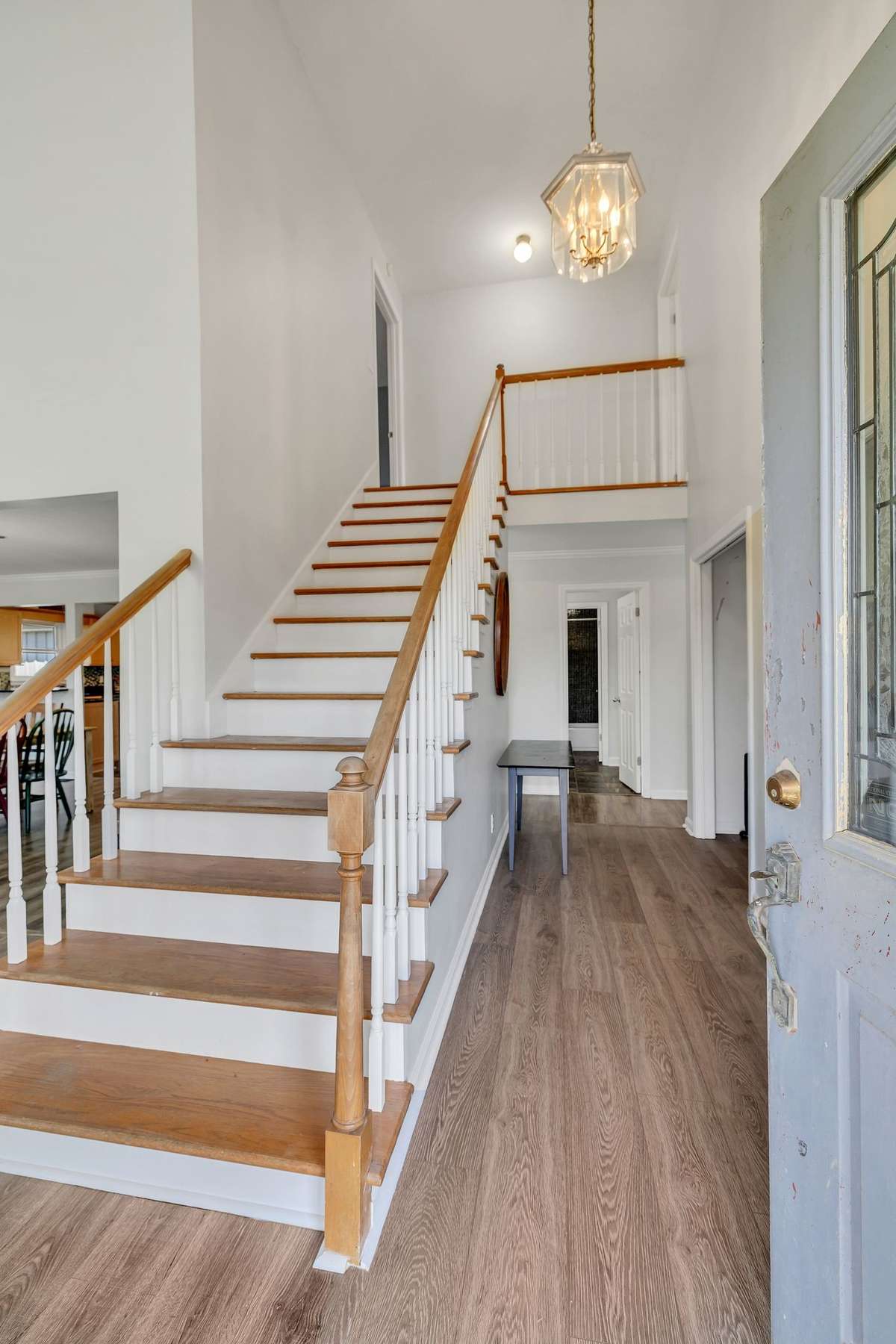 Welome in to the open entry way.  Staircase has wood tread stairs.