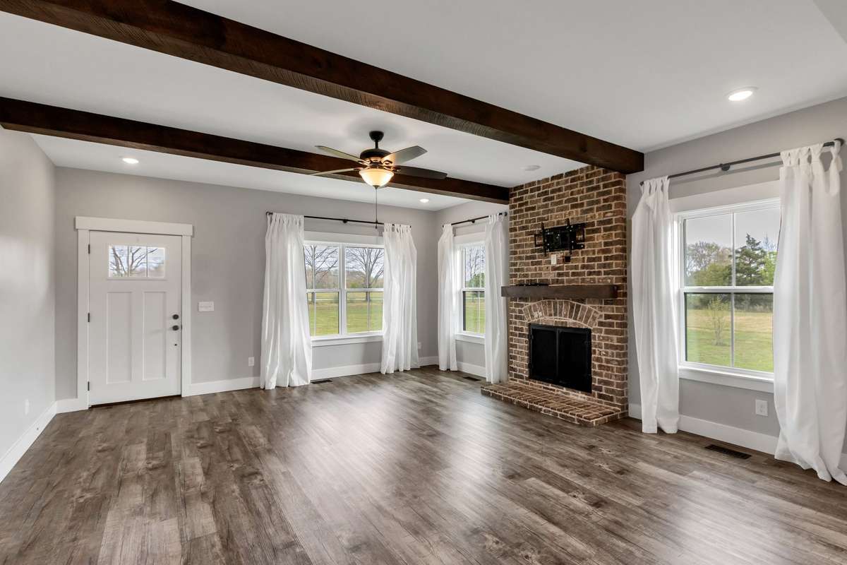 Another view of the living area & all of the natural light