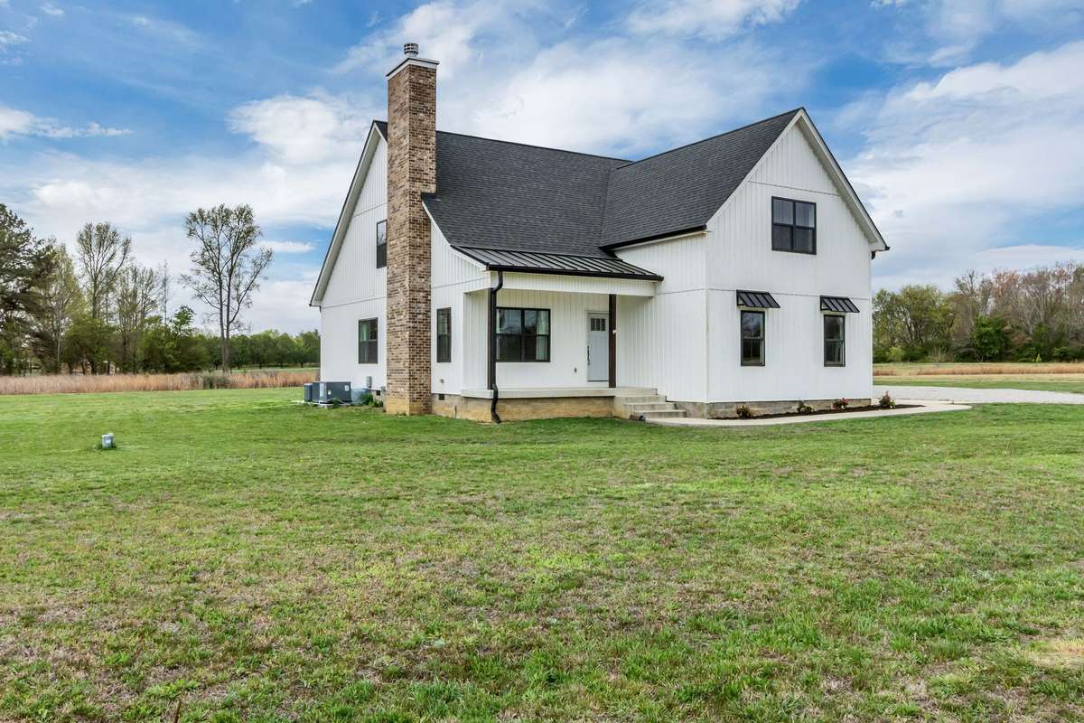 This modern farmhouse sits on 4.95 acres