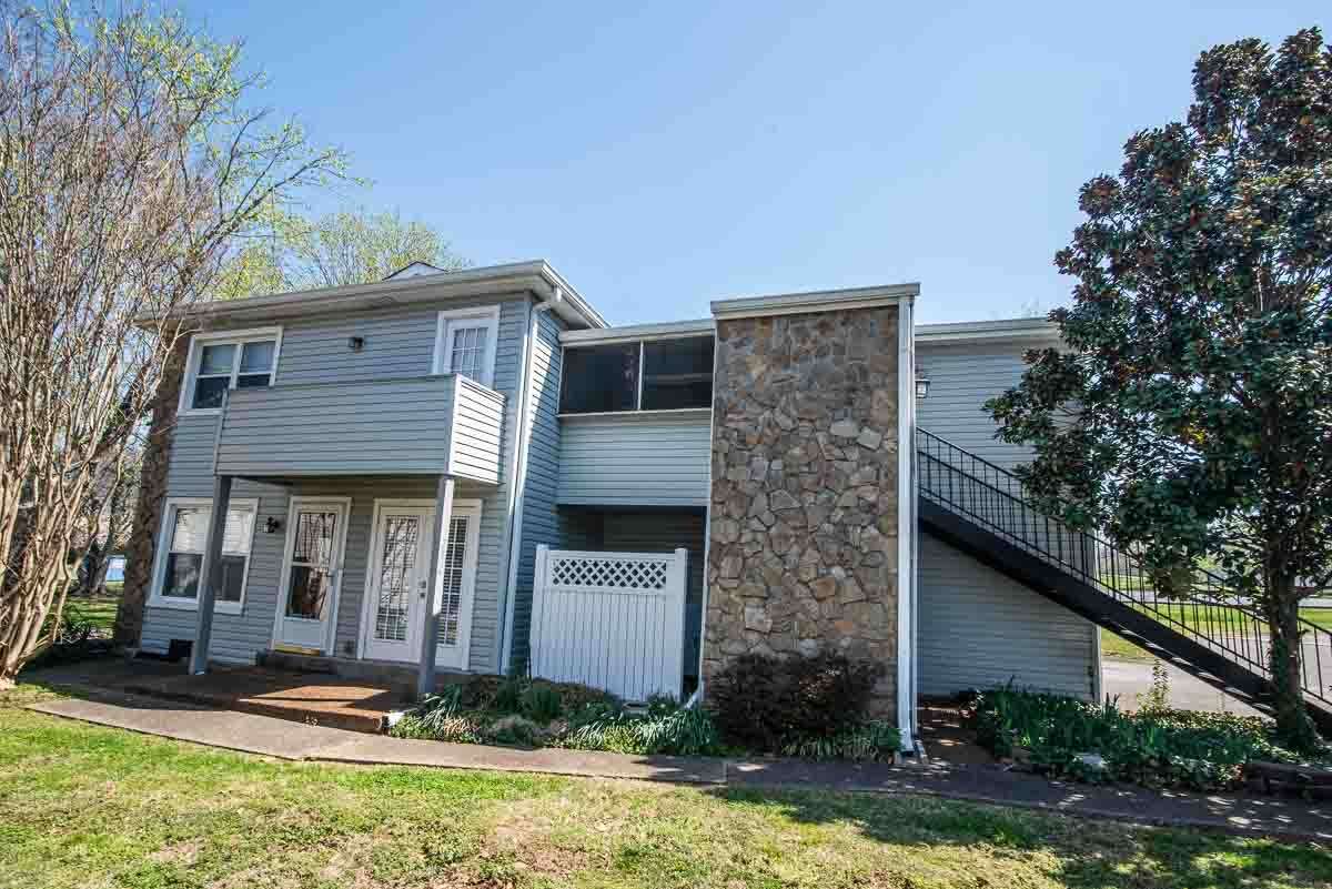 Side View of Upstairs Condo(Door inside Screened Porch)..Up the stairs in the Screened In Porch and you are there!