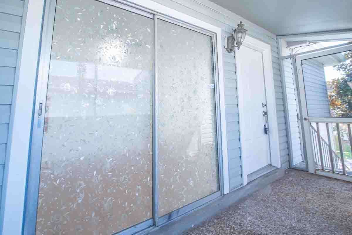 Sliding Glass Doors with Privacy  onto your Screened in Porch and an Outside Storage Area is there too!