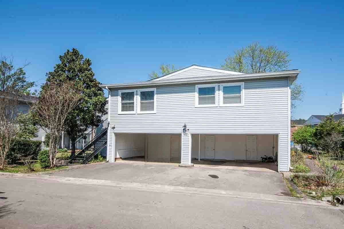 Condo has Carport Area for 1 space inside and 1 space Behind that Vechicle.. Locked Huge Storage Area..