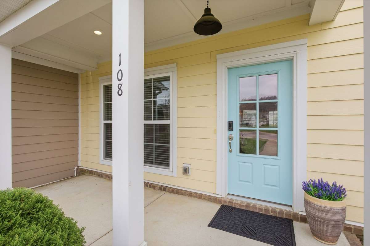 A nice covered front porch for rockers and protection from weather!