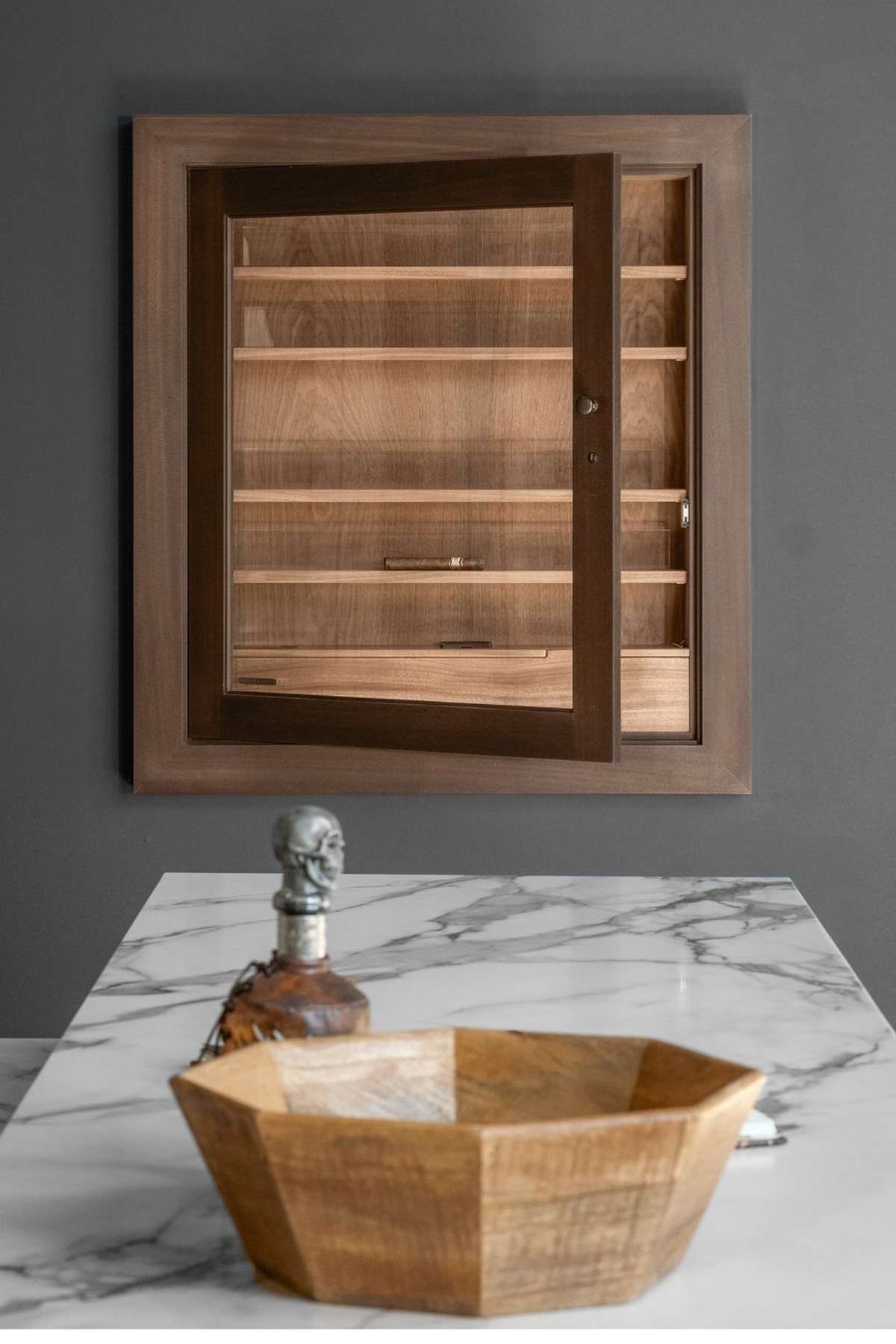 A built-in humidor keeps your collection perfectly preserved and always within reach—bringing the experience of a private lounge into your own home.