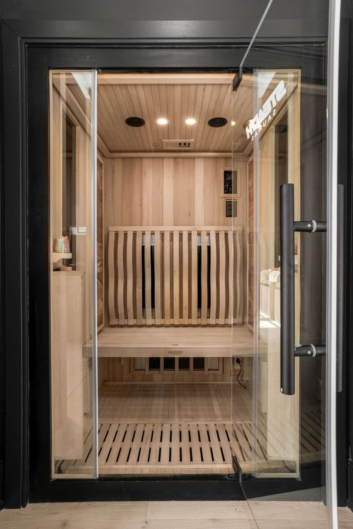 Your private wellness retreat awaits. This custom sauna offers the perfect space to unwind, recharge, and bring the spa experience home.