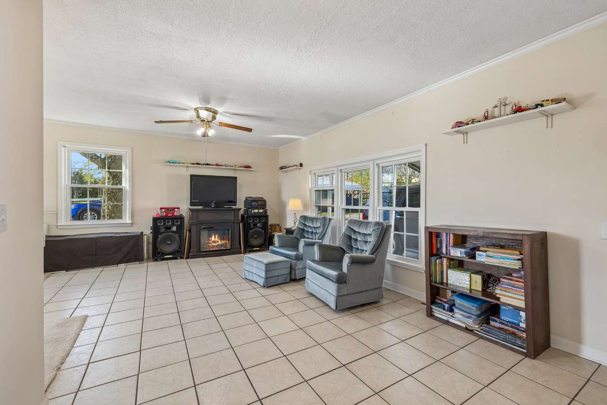 This is the great room which the family is using as office area.  Tiled floors.