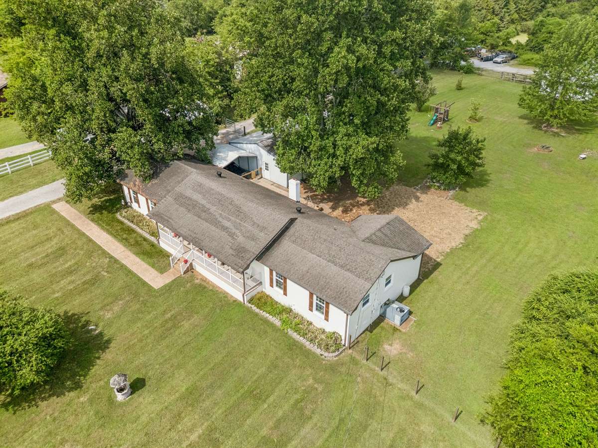 The house is attached to the garage which includes a dwelling that has 1 bedroom, full bath, living room and kitchen.