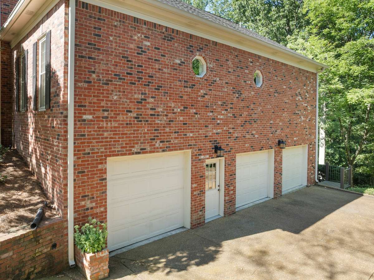 True 3 car garage with ample storage and work shop