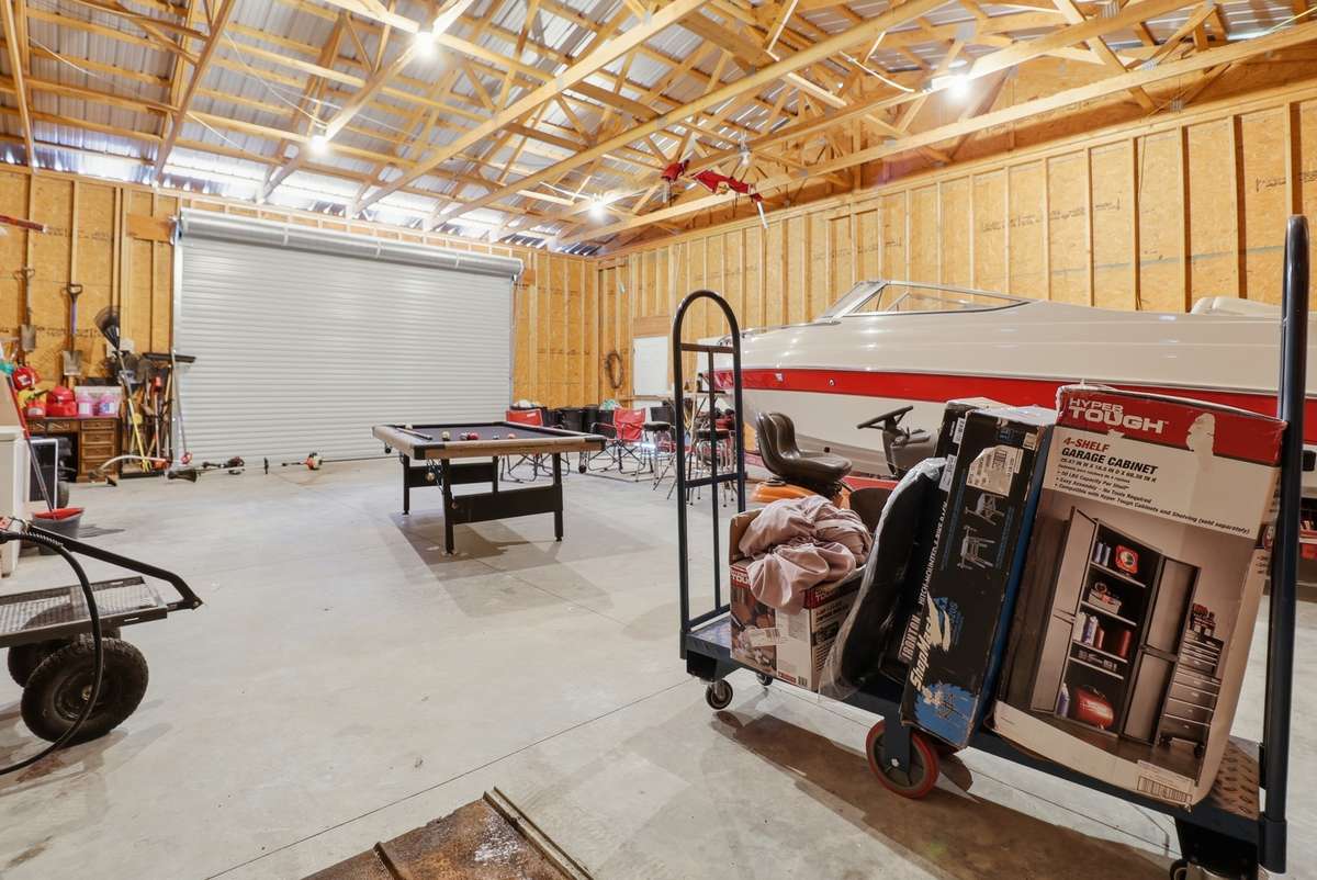 Featuring a roll up garage door for more durability and less maintenance providing max ceiling space.