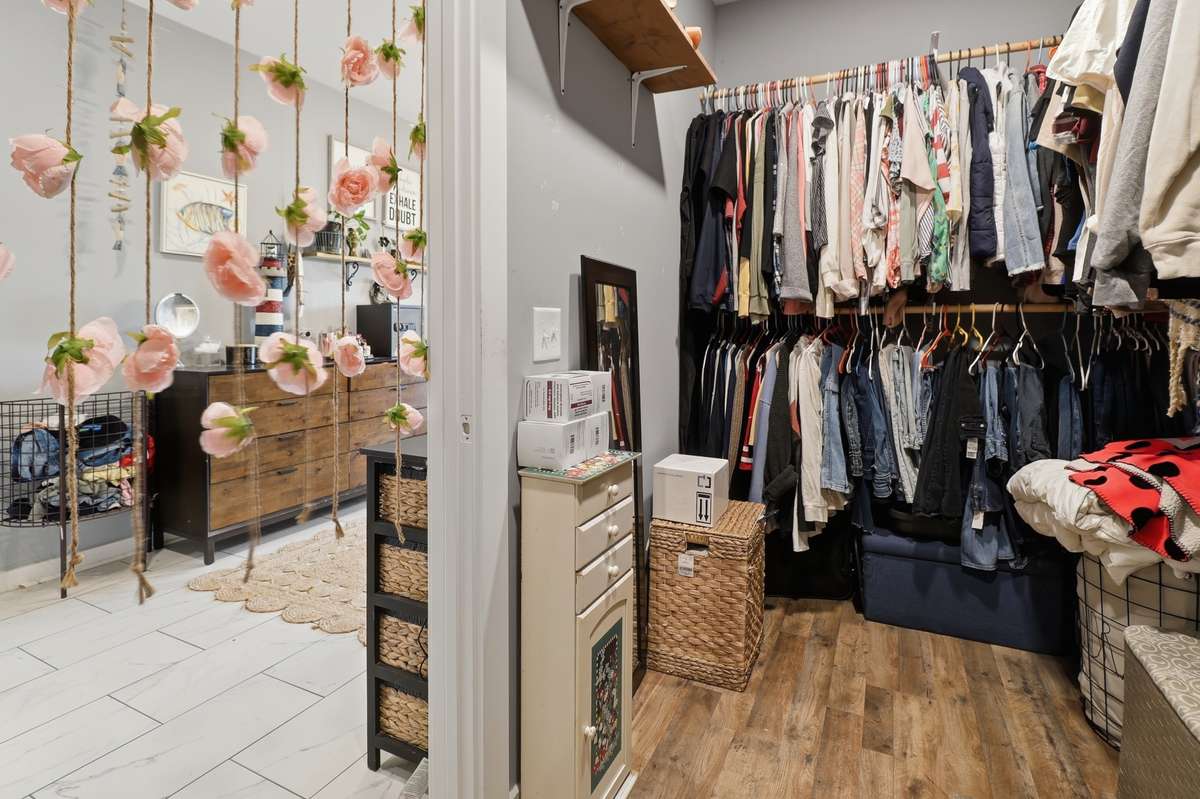 Large walk-in closet attached to extra large bathroom