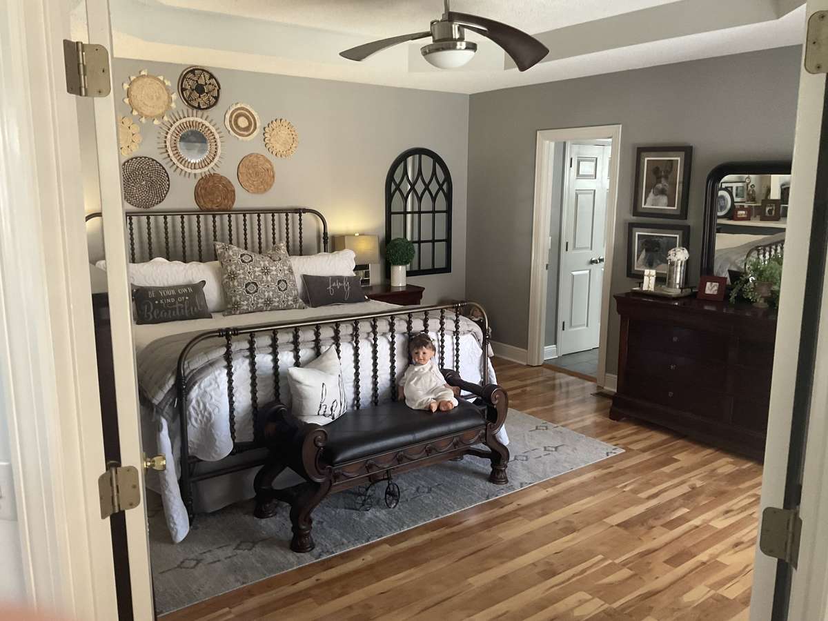 Primary bedroom with double door entry.