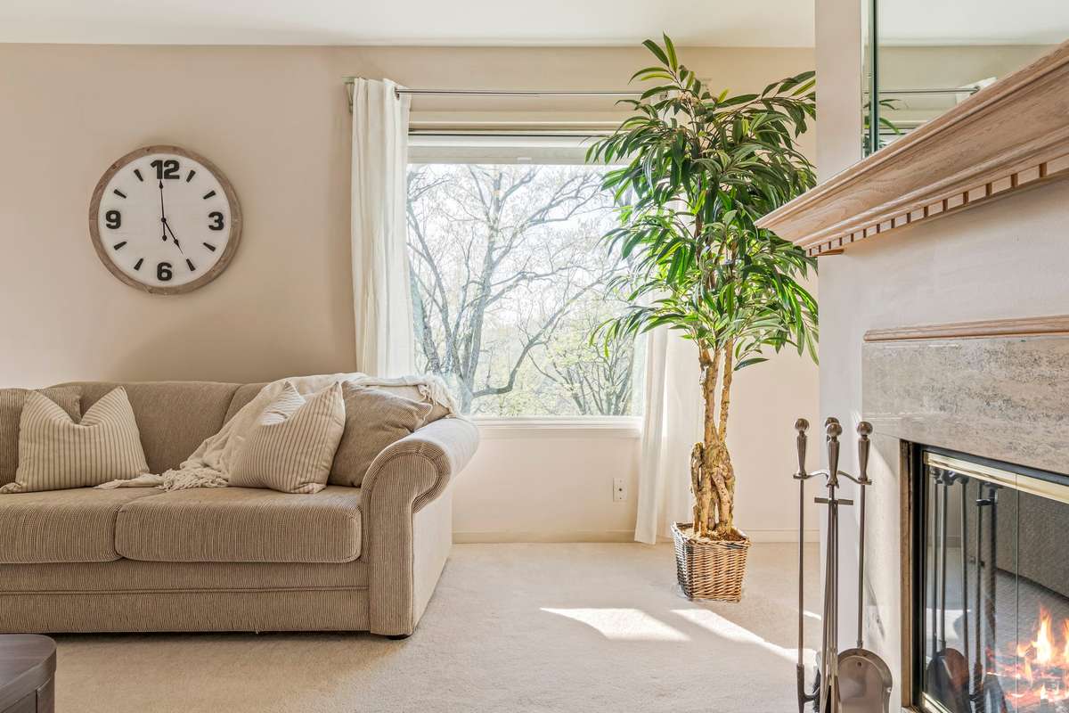 The picture window has a new rolling shade installed for privacy. Note: white curtains do not convey.