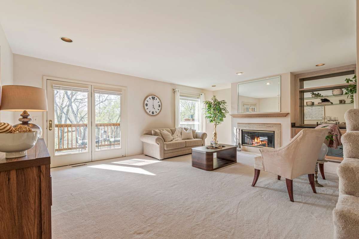 This spacious living room would be a wonderful place to host guests. It offers a breathtaking view and plenty of natural light.