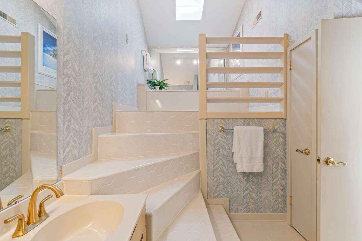 This is such a unique bathroom, with a sky light. Imagine the renovation potential here.