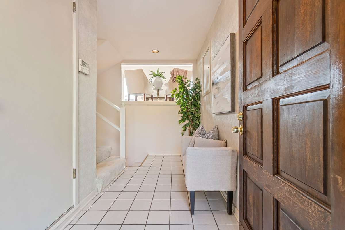 Come inside, and enjoy the natural light the storm door provides.