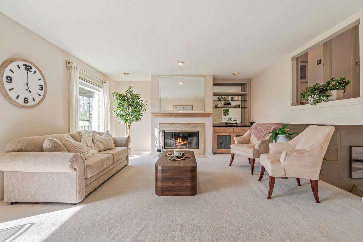 This spacious Living Room offers a breathtaking view, as well as plenty of natural light.