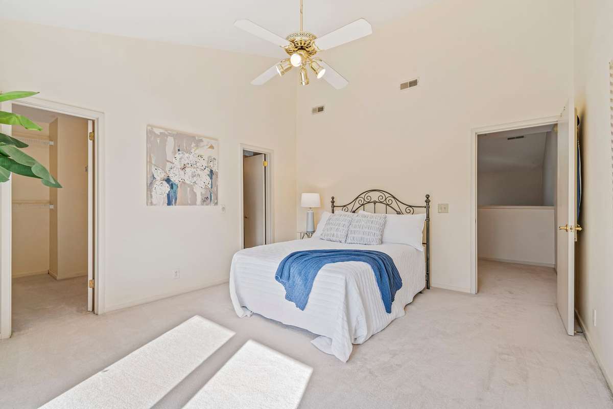 Primary (Top Floor) Bedroom with En Suite and Large Walk In Closet.