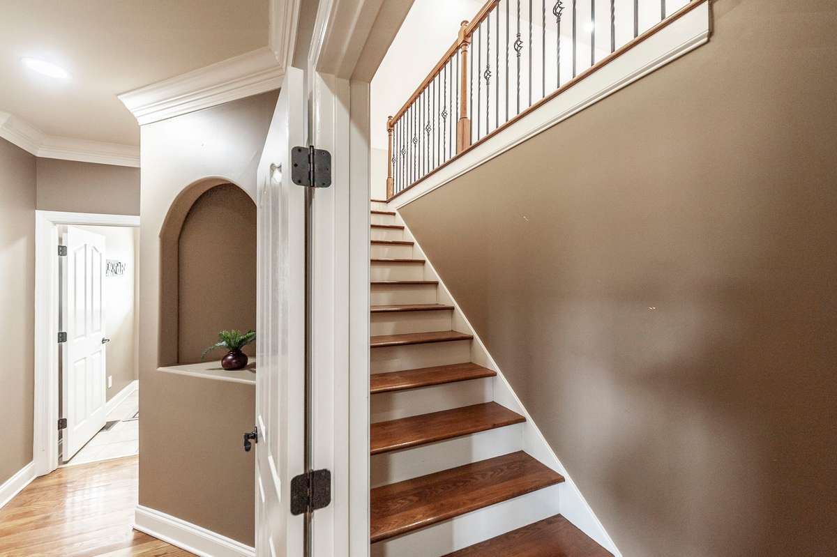 A secondary staircase located off the kitchen leads to the bonus room, providing easy and convenient access.
