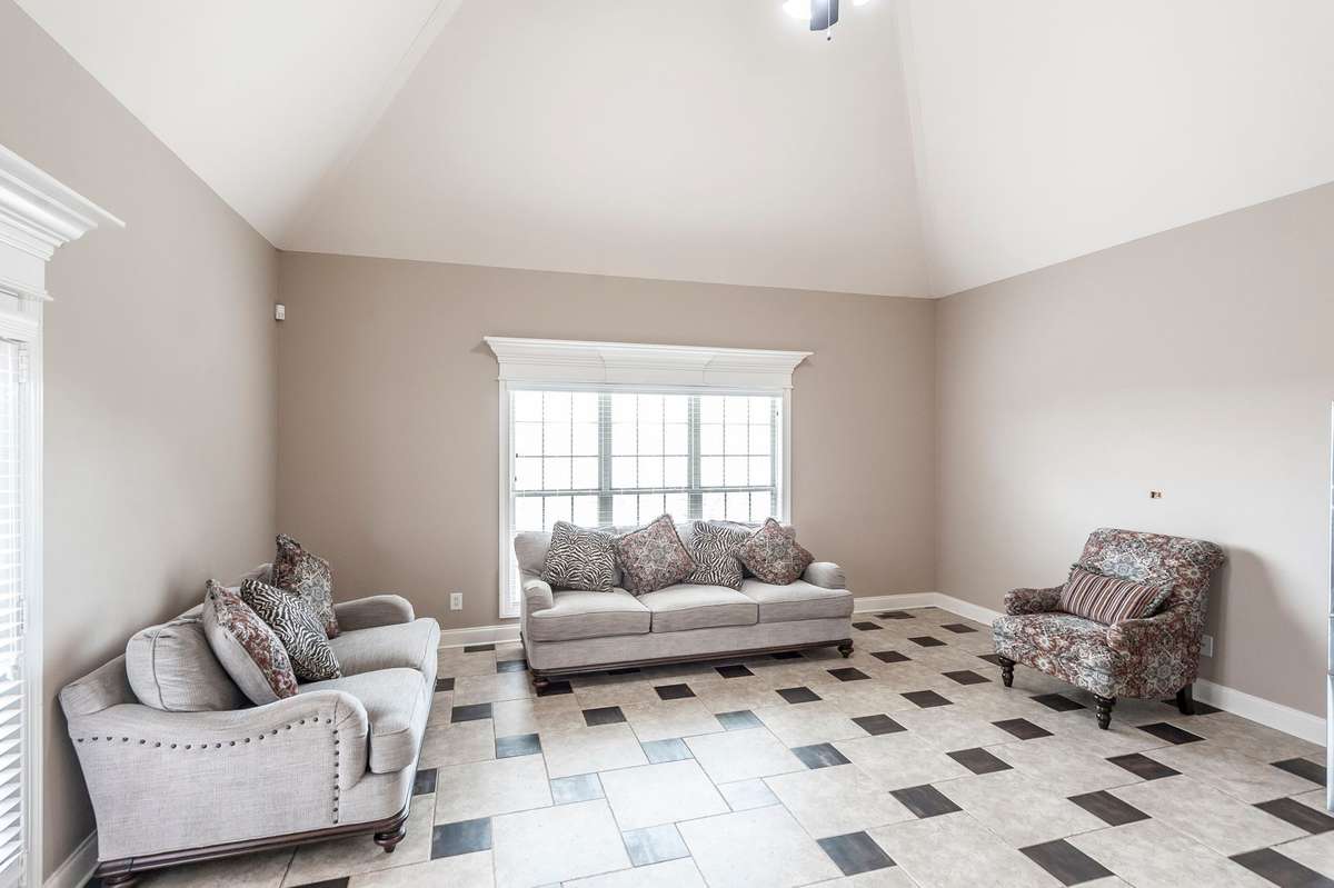 In addition to the formal dining room, the kitchen features a casual dining area for everyday meals which is presently used for an extra seating area.