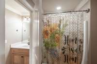 The hall bath adjoins the fourth bedroom.