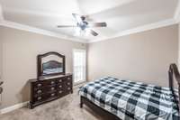 The first-floor guest room is thoughtfully positioned on the opposite side of the home from the primary suite, providing excellent privacy for guests.