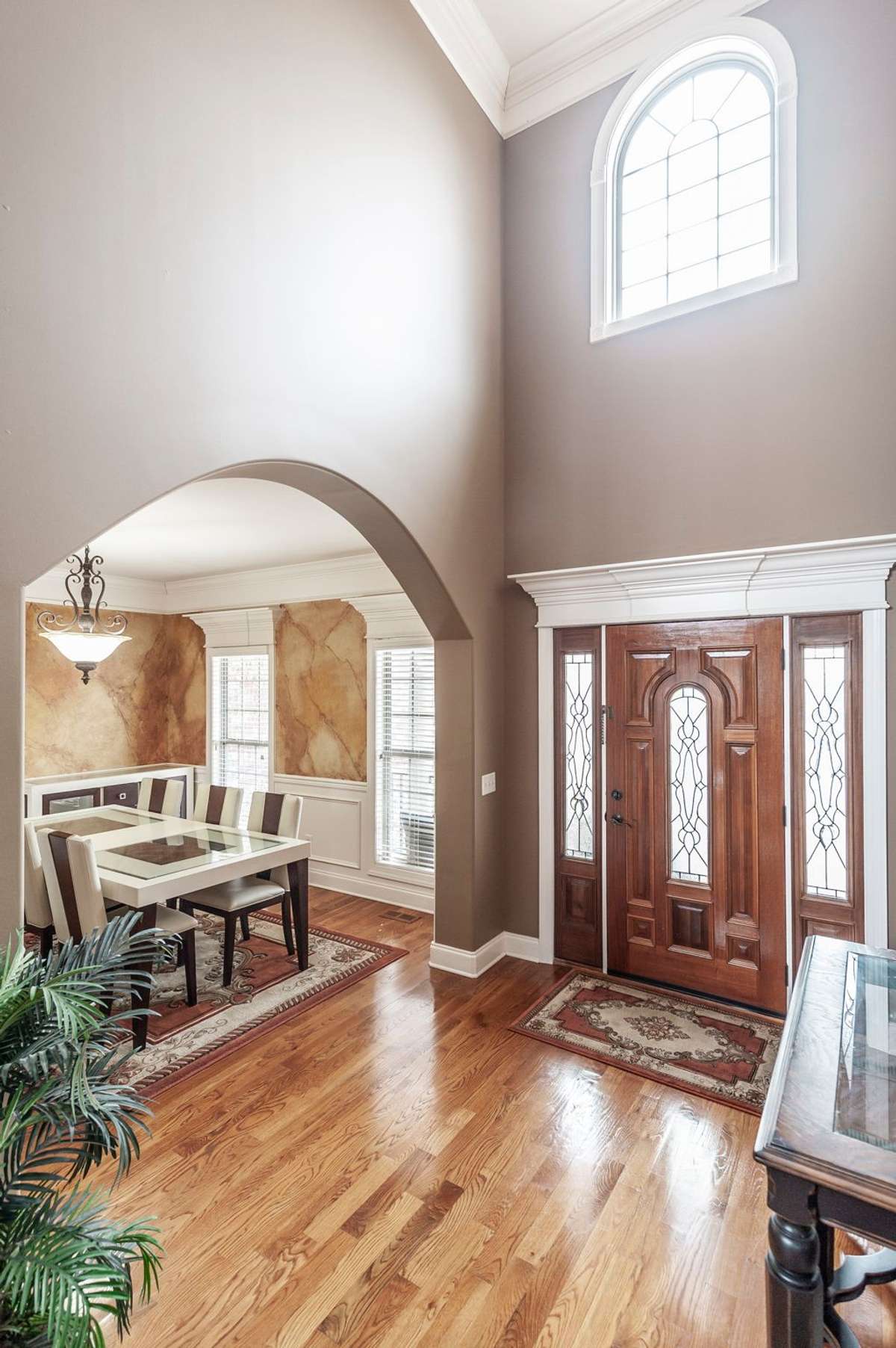 Soaring ceilings fill the space with natural light while enhancing the overall ambiance.