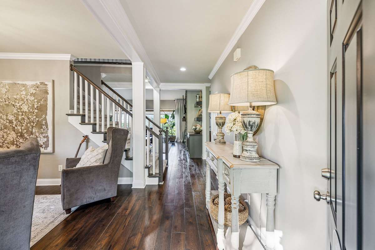 Walk into a spotless and welcoming home! The foyer has Hardwood floors and opens to the formal Dining Room and Great Room