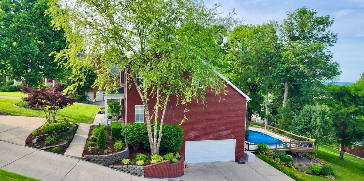 The side of the house shows all the landscaping. The flowers are just beautiful in the Spring. It is your own little paradise