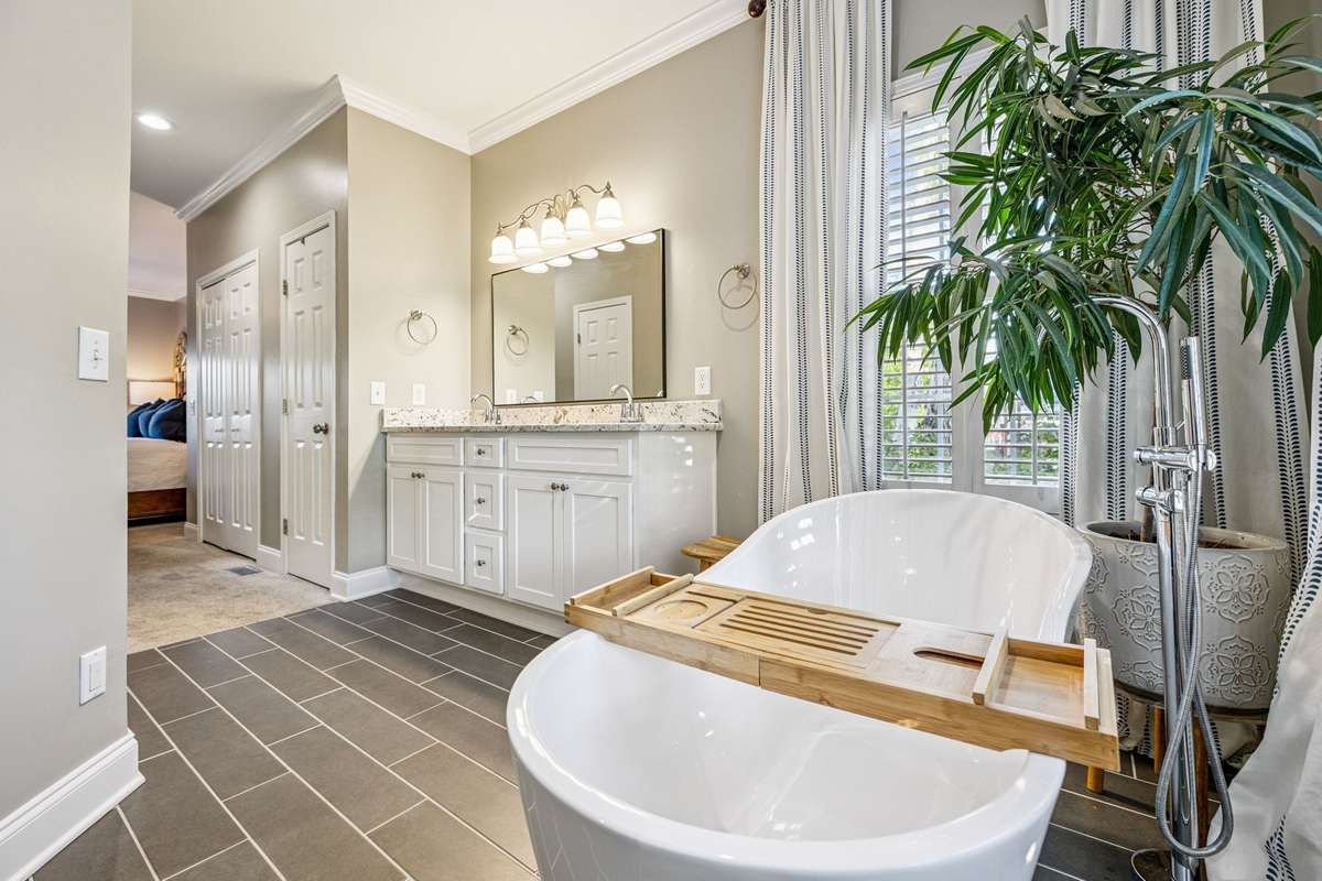 The stand alone tub and new tile are just beautiful