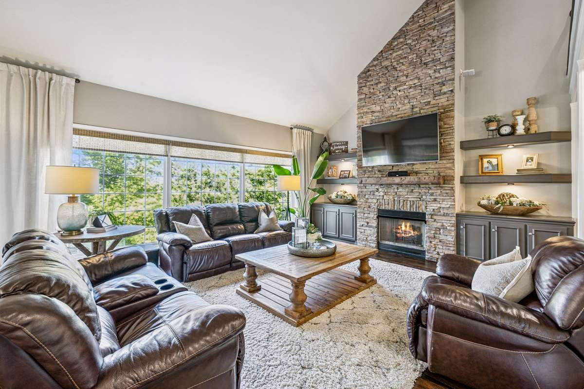 The Great Room has vaulted ceilings, soaring stone fireplace, built in shelves (hidden compartments and under lighting) and storage. The view from this room is stunning.