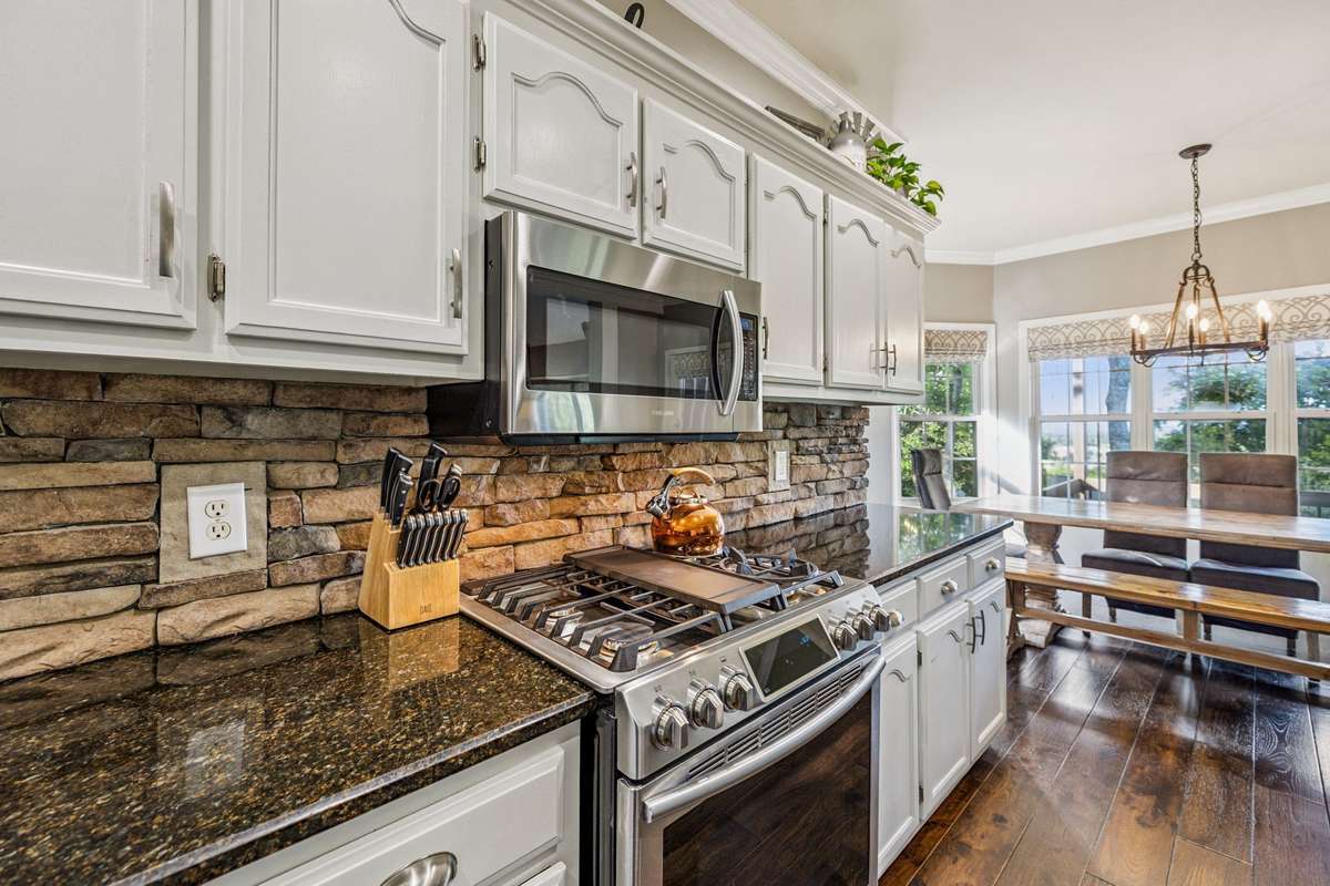The Family Room opens up to the kitchen and Breakfast Nook area. The kitchen was remodeled by the seller and the stainless steel appliances are all upgraded.